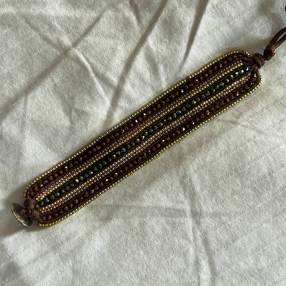 Beautiful beaded wrap bracelet. Rich brown and deep green beads with gold beads.